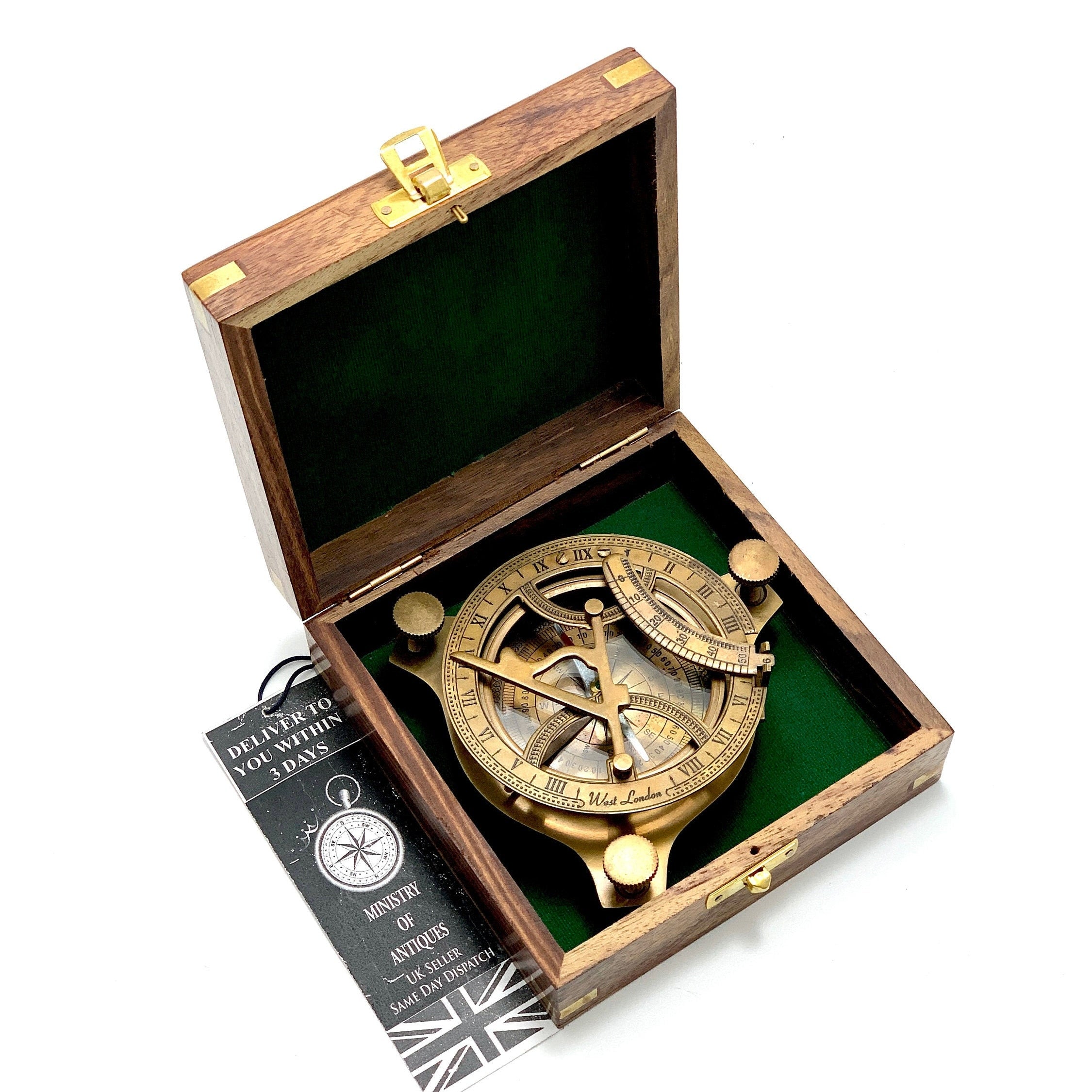 May include: A brass compass with a wooden box. The compass has a compass rose, a sundial, and a time scale. The box is lined with green felt.